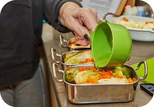 pours-sauce-cabbage-rolls-with-salmon.jpg